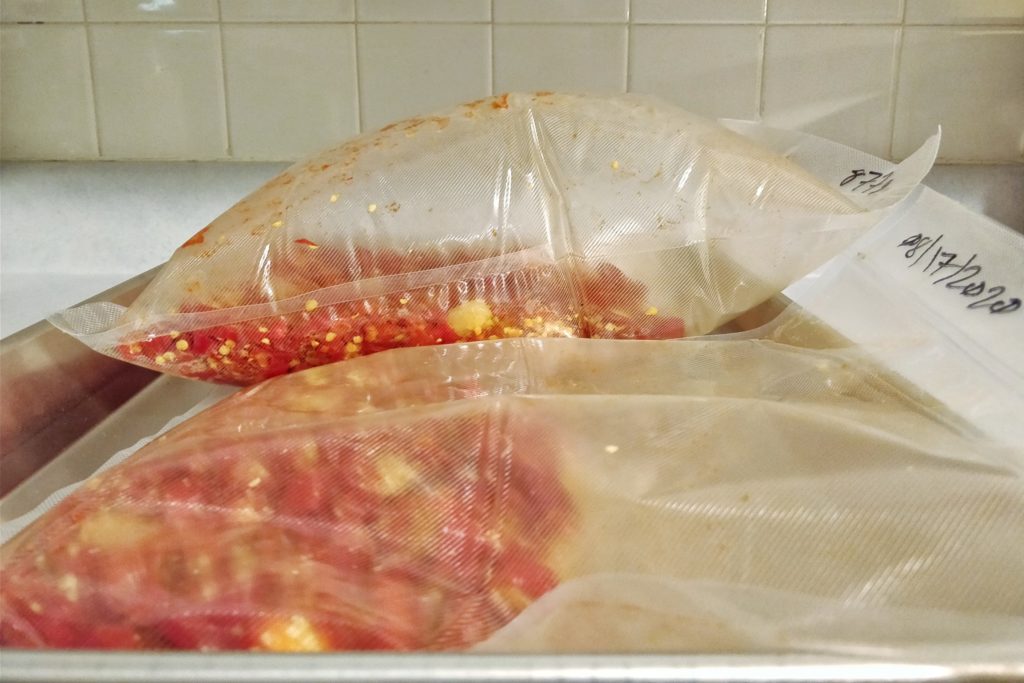 Don't have vacuum sealer. Tried to use straw and lungs to pull vacuum.  Looking alright so far…. : r/fermentation