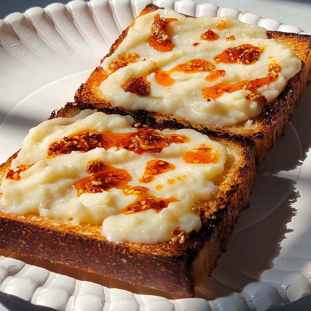 Koji ricotta spread on toast with some chili crisp drizzled on top.