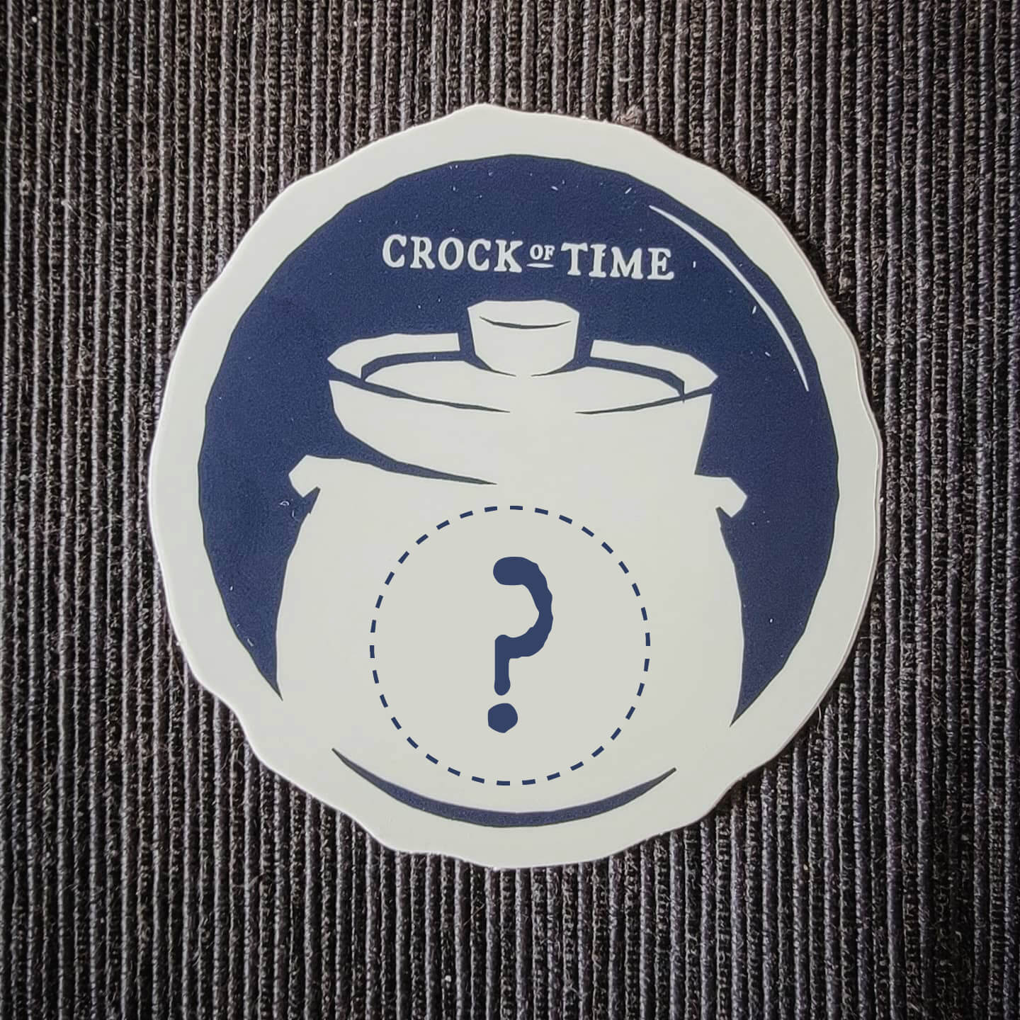 Crock of Time sticker with a dashed circle and question mark im place of the hourglass symbol in the logo.