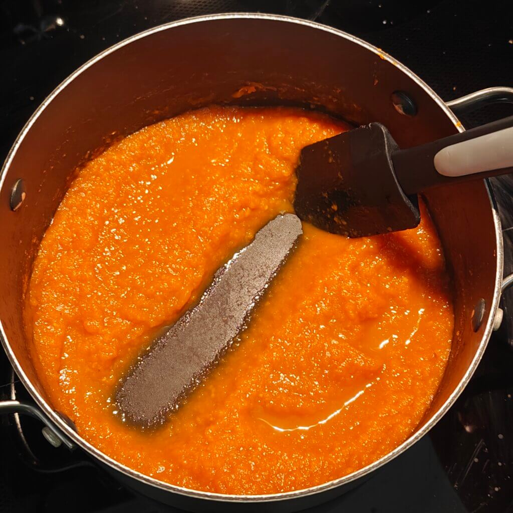 Pulp cooked down until spoon can uncover bottom of pot.